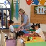 Playgroup teachers with children in safe Dehradun preschool