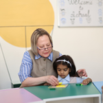 Playgroup teachers with children in safe Dehradun preschool